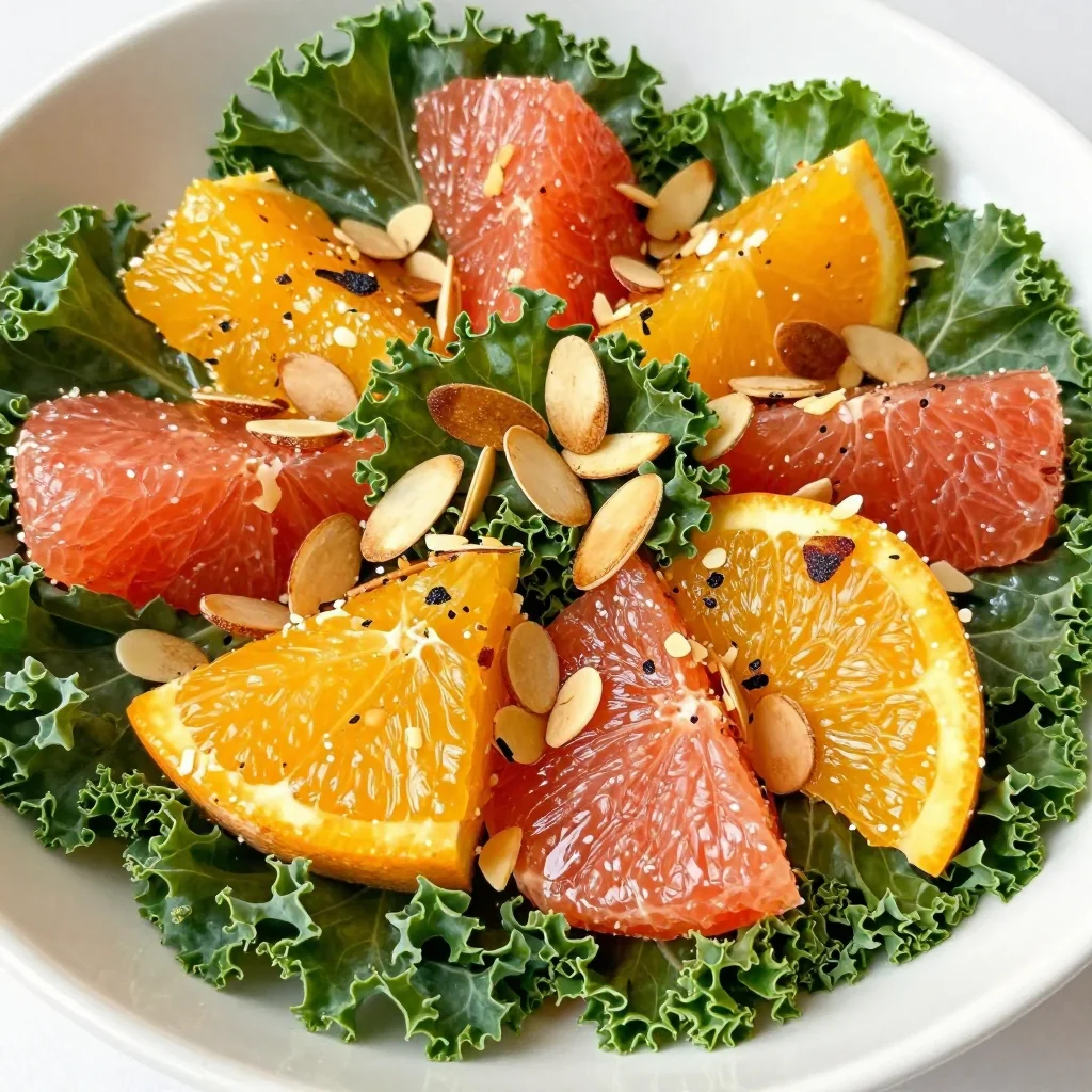 warm citrus and kale salad with toasted almonds for clean eating